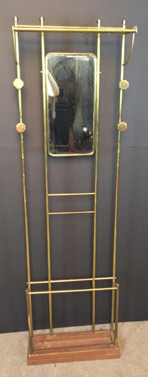 Antique 19th C Brass Coat Rack: Antique umbrella, coat & hat rack. Features mirror, hooks, shelf and umbrella rest. Removable tin drip tray sits in iron base. Height: 73 3/8"; Width: 21 3/4"; Depth: 9 1/2". Imperfections include chi