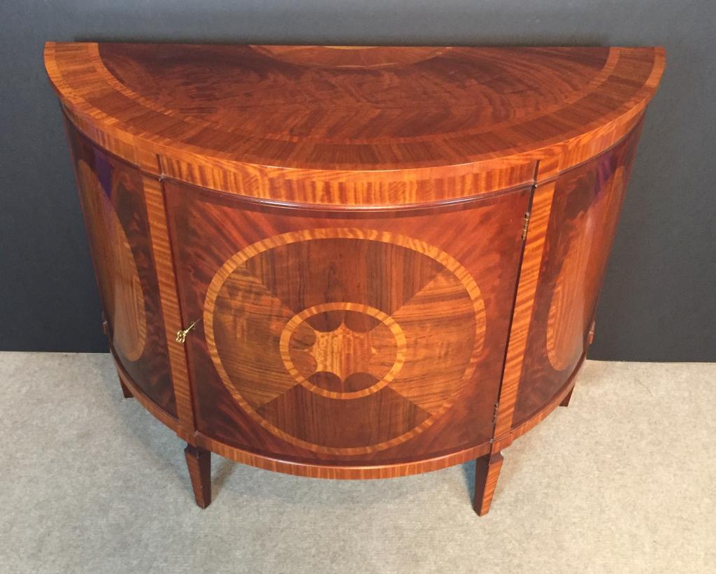 Inlaid Satinwood and Mahogany Demilune Commode: Neoclassical-Style Inlaid Satinwood and Mahogany Demilune Commode, labeled "Historic Charleston Reproductions, Baker Furniture", highly figured crossbanded top with radial inlay, case with oval panels