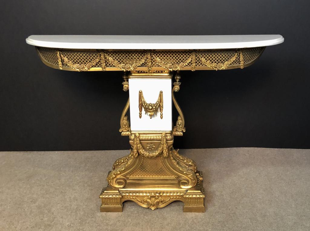 Marble & Dore Bronze Console Table: Louis XVI dore bronze & marble console table. Imperfections include loose pieces, chip to marble. Height: 29 3/4"; Width: 43 3/"; Depth: 10 3/4". STERLING ASSOCIATES STRIVES TO PROVIDE ACCURATE, OBJEC