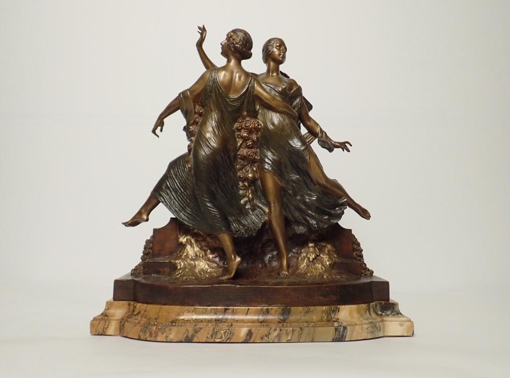 Early 20th C Art Deco Signed Guirande Bronze: French art deco patinated bronze depicting two dancing women on marble base. Signed "Guirande" and coin seal "Medaille D'or. Incised 8840 JD". Dimensions21"W Ã— 9.25"D Ã— 21"H. STERLING ASSOCIAT