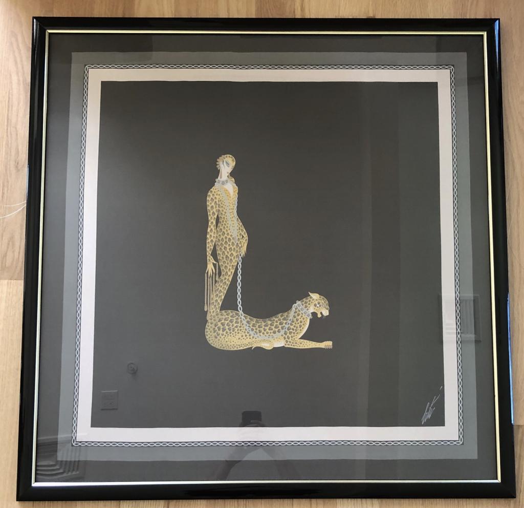 Romain De Tirtoff (1892-1990) Signed Erte: Erte "Letter L" lithograph on silk, framed under glass in black lacquer frame with gilt interior trim. Signed "Erte" bottom right. Imperfections. Dimensions: 37.5" x 38" (with frame). (art deco, serig