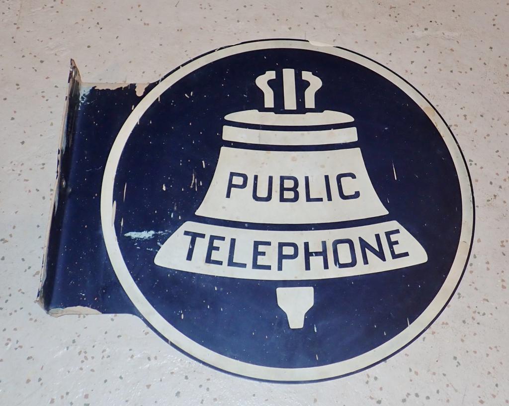 Vintage Public Telephone Double Sided Flange Sign: Vintage metal round double sided flange sign for public telephone. Metal / porcelain. Mounting side marked: KS-16597, L-2. Height: 18 1/4"; Width: 19 1/2"; Depth: 2 1/8". Imperfections, age. STERLING 