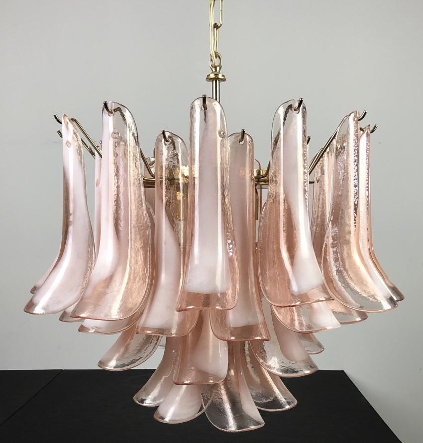 Italian Vintage Murano Mazzega Glass Chandelier: Vintage four-tier Murano Mazzega feather tulip petal shoe horn chandelier. 36 pink and white blown glass petals, brass cage. . Glass pieces are marked. Height: 22"; Width: 18". STERLING ASSOCIATES STR