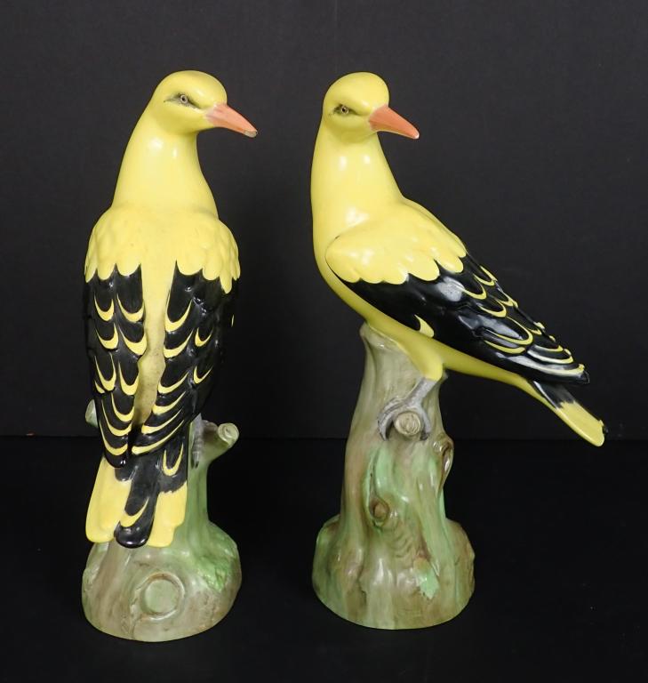 Pair Copeland Spode Porcelain Birds: Two perched porcelain yellow and black birds. Marked Spode Copeland's China England on bottom. Imperfections include small chip to underside of one beak. Height: 10 1/4"; Width: 3 1/12"; Depth: 6". ST