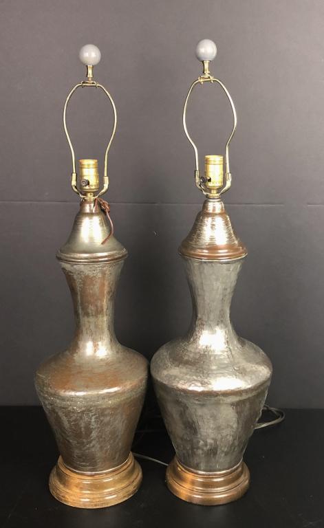 Pair of Hammered Copper Lamps: Set of two table lamps with hammered copper, brushed silver finish (tinned). Wood base. Unmarked. Height to finial: 32"; Diameter: 6 1/2". (James Mont, Lighting, Interior Design) STERLING ASSOCIATES S