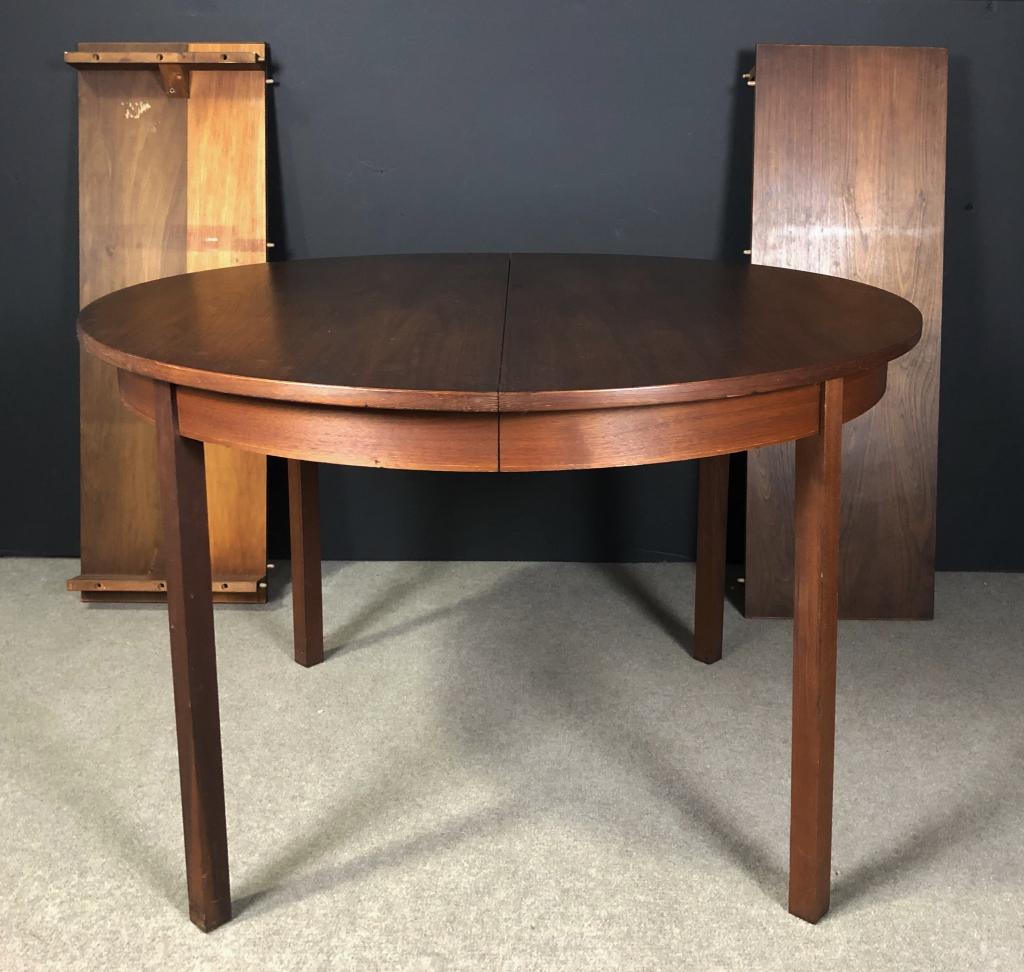 Round Walnut Harvey Probber Dining Table w/ Leaves: Vintage round dining table. Attributed to Harvey Probber. Unmarked. Includes two leaves. Height: 29"; Diameter: 45". Each leaf: 15" wide. Imperfections. (furniture, interior design, kitchen) STERLING