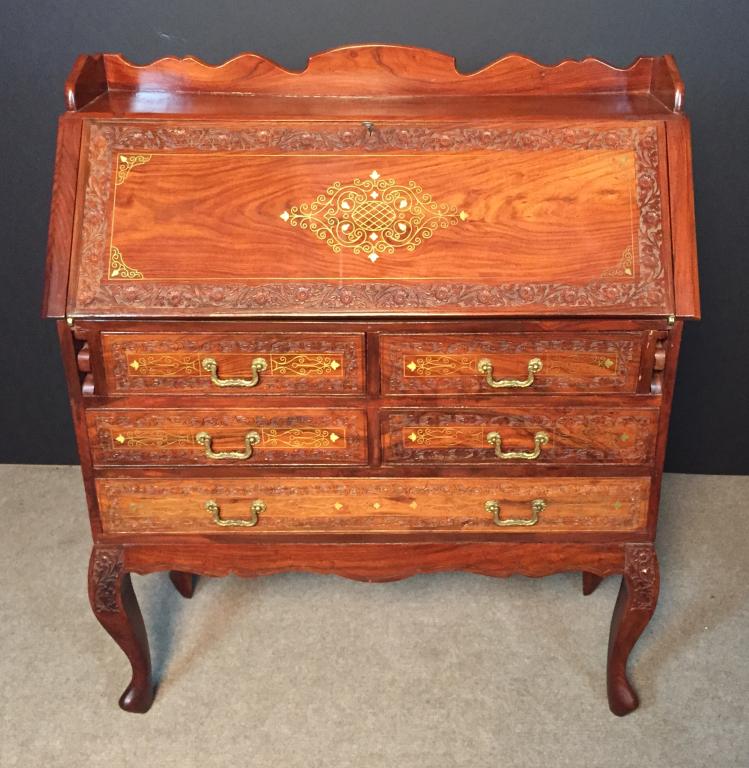 Slant Top, Brass Inlay Rosewood Desk: Anglo Indian brass inlay rosewood Desk, Slant Front. Carved and inlaid detail. Floral design and brass hardware. Flip down top reveals desk cubbies, shelving and one center drawer with inlaid design.