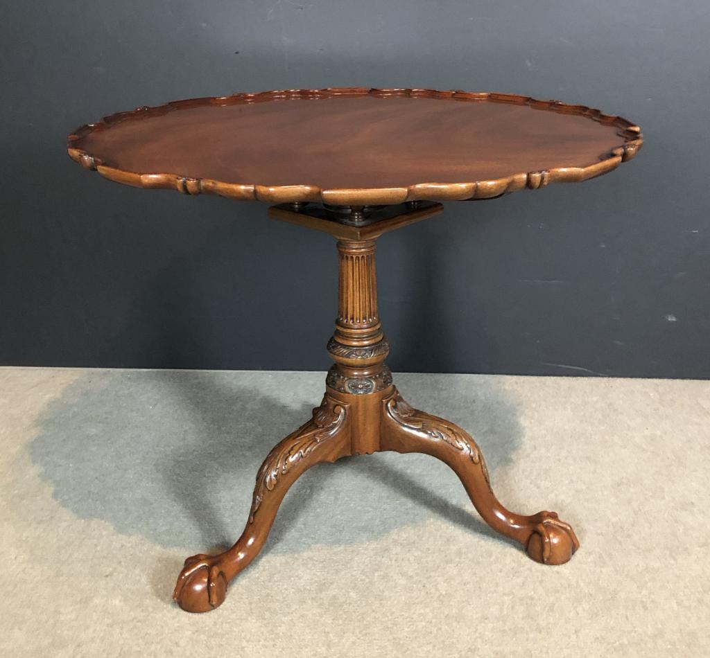 Pie Crust Tilt-Top Table, 20th C. Kindel: Chippendale sylte mahogany pie crust tea table. Kindel Winterthur Reproduction Philadelphia Tea Table. The carved pie crust edge tilt-top is supported by a bird-cage block above a turned shaft with a 