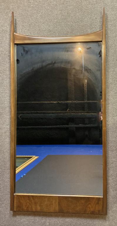 John Widdicomb Modern Wall Mirror: Modern wood frame wall mirror by John Widdicomb. Plaque on back reads Made by John Widdicomb. Height: 52 1/2"; Width: 25". Partner with the rest of the Widdicomb bedroom suite in lots # 103, 105, 106,
