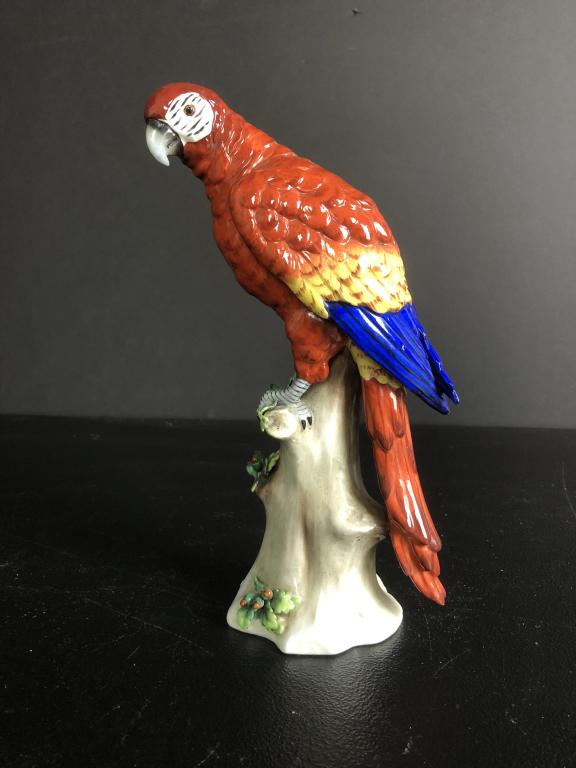 Capodimonte Porcelain Red Parrot: Capo di Monte Red Macaw Makers mark on bottom. Height: 9 1/4"; Width: 4 1/2". STERLING ASSOCIATES STRIVES TO PROVIDE ACCURATE, OBJECTIVE, & FAIR INFORMATION ON ALL LOTS. WE WILL BE HAPPY TO ANSWER ANY