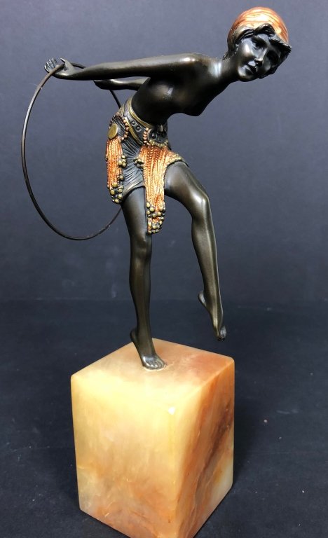 Early 20th C Antique Art Deco Bronze Hoop Dancer: Beautiful quality Art Deco hoop dancer in a multitone patina mounted on an onyx or alabaster base. Overall height 11 inches. Height of bronze only 7.5 inches.Dimensions: 2.75"W × 2.75"D × 11"H. Mino