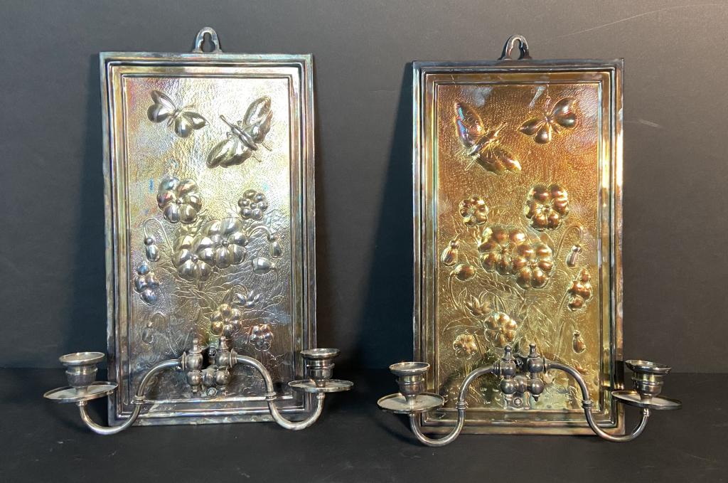 Silver Plate Swing-Arm Wall Sconce Pair: Set of 2 Silver over brass, Swing arm wall sconces. Flower & butterfly design. height: 15"; Width: 10 1/2". STERLING ASSOCIATES STRIVES TO PROVIDE ACCURATE, OBJECTIVE, & FAIR INFORMATION ON ALL LOTS. 