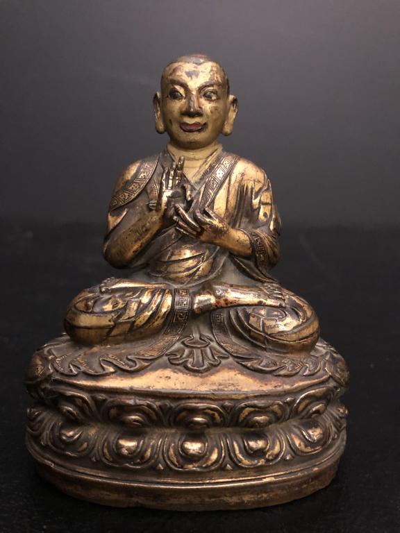 Gilt Bronze Buddha: Fine quality gilt Bronze Buddha with traces of polychrome. Bottom covered with copper plate with etched rosette. Height 4.25 in.STERLING ASSOCIATES STRIVES TO PROVIDE ACCURATE, OBJECTIVE, & FAIR INFOR