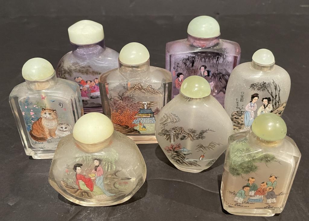 Eight Chinese Painted Glass Snuff Bottles: Group of 8 Chinese glass inside painted snuff bottles with Jade cabochon top stoppers. Figural with women, children and animals. 4" height of tallest. From and Englewood Cliffs NJ estate.