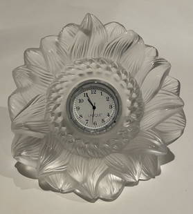 Lalique Sunflower Clock: Lalique Sunflower Clock. STERLING ASSOCIATES STRIVES TO PROVIDE ACCURATE, OBJECTIVE, & FAIR INFORMATION ON ALL LOTS. WE WILL BE HAPPY TO ANSWER ANY QUESTIONS AND PROVIDE ADDITIONAL PHOTOS. WE 