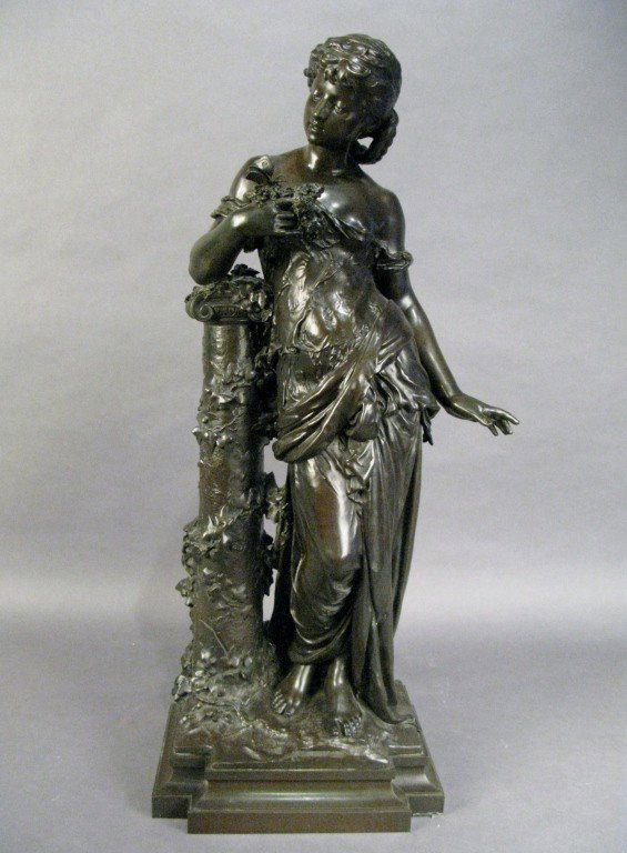 A. Moreau (1834-1917), Woman leaning on pedestal: Auguste Moreau (1834 - 1917) French Patinated bronze, woman leaning on pedestal with flowers and butterfly in hand signed: A. Moreau 33"T Base: 12 1/2"L, 9 1/4"W