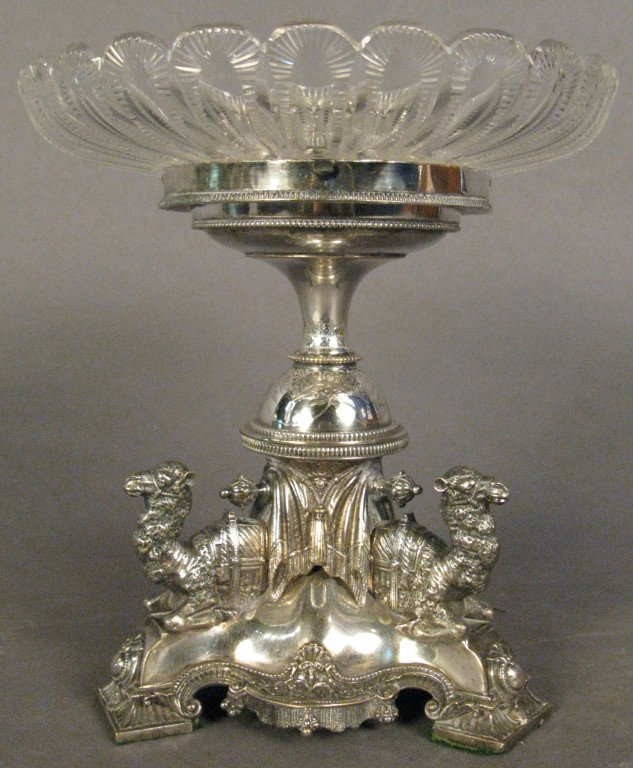 Figural centerpiece: Silver plate and cut glass figural center piece lead solder marks on top rim 8 5/8"T Glass: 8 3/16" diameter