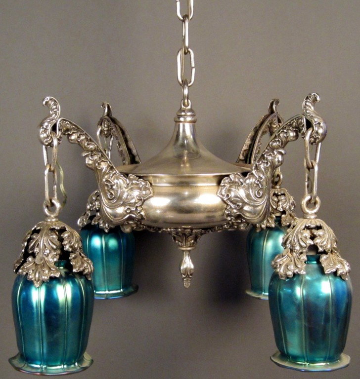 Silver over bronze down light pan style fixture: Silver over bronze down light pan style fixture with iridescent blue glass, circa 1910 4 arms Height: 40", Width: 21"