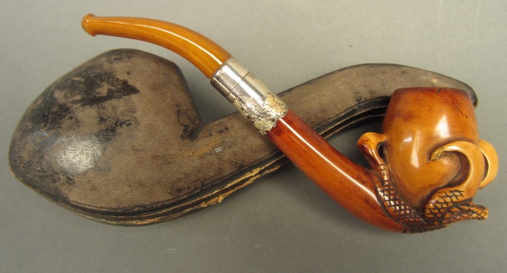 Meerschaum Pipe, Carved as a Dragon claw: Antique meerschaum smoking tobacco pipe, carved design of a dragon's talon grasping the bowl with sterling floral band,in fitted case. Length: 6 5/8"