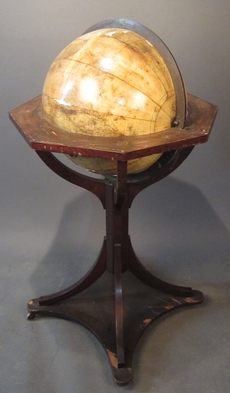 World Globe on Pedestal Stand, circa 1800: World globe on four-leg pedestal base and wheels. Continental circa 1800 Height: 48", Width: 28"