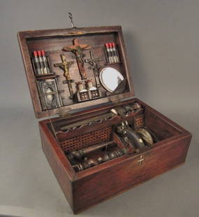 Vampire Killing Kit Chest, Continental circa 1900: Vampire Killing Kit Chest. Continental circa 1900 Chest includes: 3 crucifix, 2 stakes, mallet, vials, bible, mirror, gun, silver bullets, powder flask, dagger, & postcard Height: 7", Width: 18"