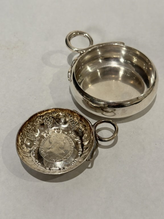 2 Sterling Silver Porringers/ Wine Tasting Dishes 2 sterling silver porringers/wine tasting cups.: 2 sterling silver porringers/wine tasting cups. One marked Cartier and one hallmarked. 3" x 4" 160 g. STERLING ASSOCIATES STRIVES TO PROVIDE ACCURATE, OBJECTIVE, & FAIR INFORMATION ON ALL LOTS. WE WIL