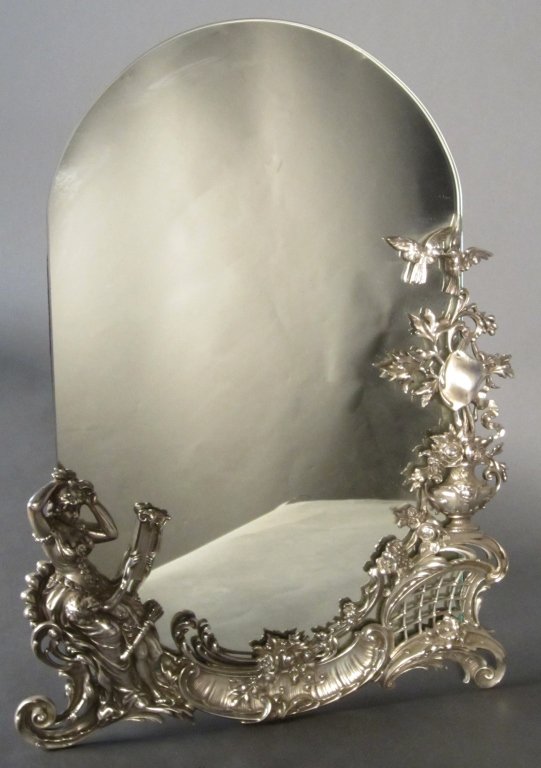 Silver over Bronze Figural Mirror: Silver over bronze figural mirror. French circa 1900 Height: 20 1/2", Width: 20 1/2", Width: 15"