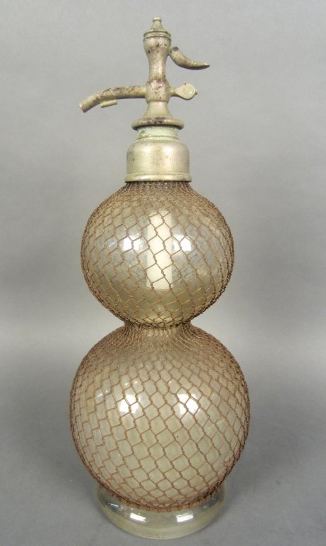 Antique Double Bulbous Shaped Siphon Bottle: Clear glass double bulbous shaped siphon bottle with fitted, metal netting and pewter spout stamped: BA & Co. London Height: 17 1/2", Width: 6"