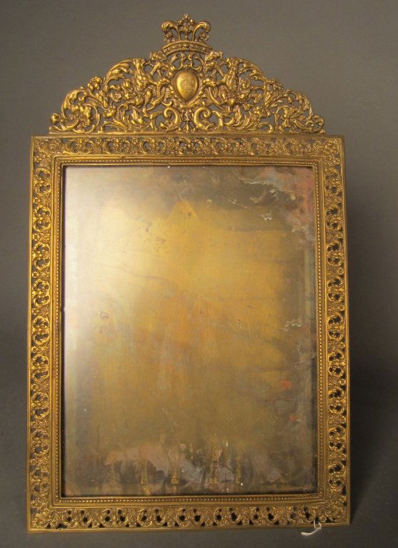 Marked: Tiffany & Co. Brass Picture Frame: Ornate, large bronze picture frame baring the Tiffany & Co. circa 1900. mark on the back. old repair to top. Height: 18 1/4", Width: 12 3/4"