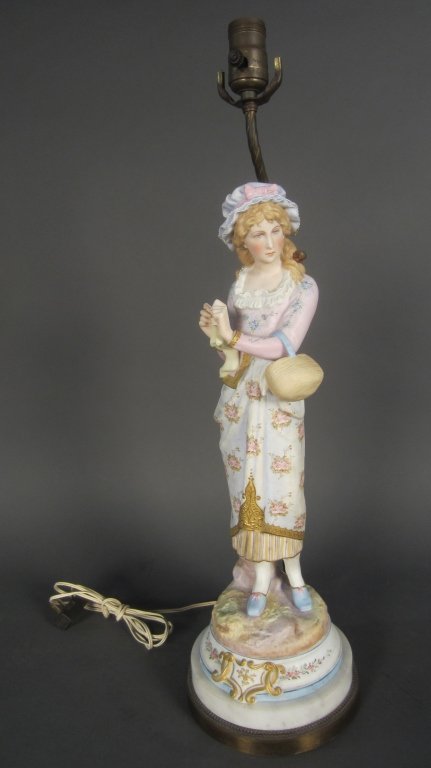 Porcelain Figural as Lamp, Continental: Continental porcelain figure as lamp on marble, mounted on brass base. Porcelain mark: G intertwined with an S Height: 26", Width: 7"