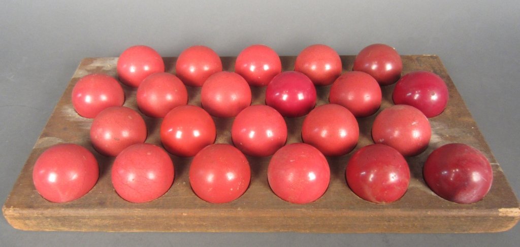 Antique Game w/ 22 Red Balls: 22 Antique red balls in fitted wood tray. Diameter of ball: 2", Board length: 17", Width: 8 5/8"