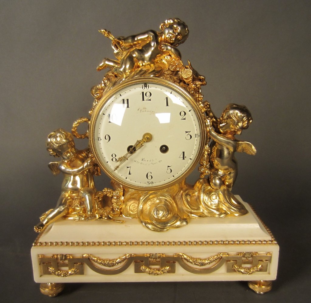 White Marble Clock, French 19th C: White marble figural clock with bronze ormolu, French 19th Century. We do not guarantee clocks to be in working condition. Height: 14", Width: 12"