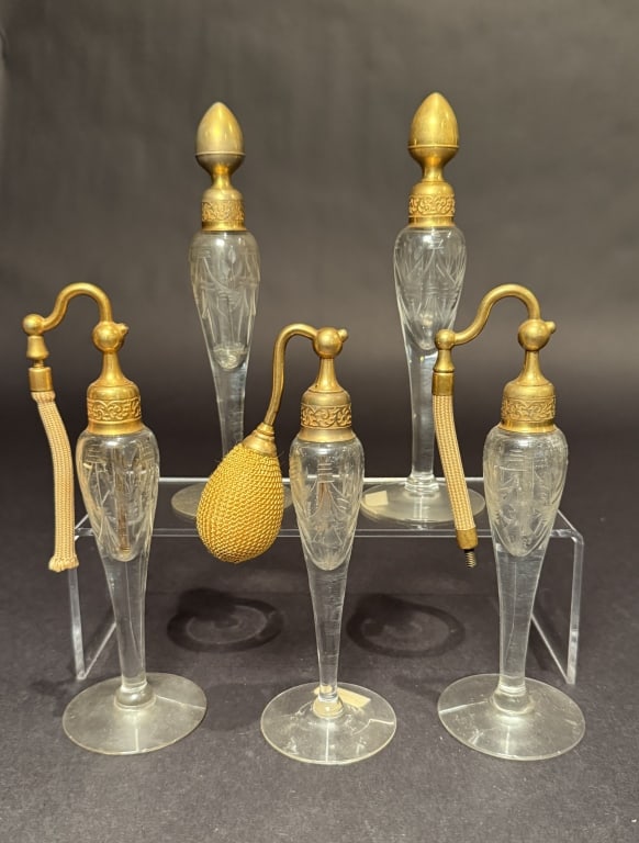 Collection Of 5 DeVilbiss Perfumes And Atomizers: Wheel cut.Tallest 6.75". The Estate of the late Judy Boyd, New Jersey.STERLING ASSOCIATES STRIVES TO PROVIDE ACCURATE, OBJECTIVE, & FAIR INFORMATION ON ALL LOTS. WE WILL BE HAPPY TO ANSWER ANY QUESTIO