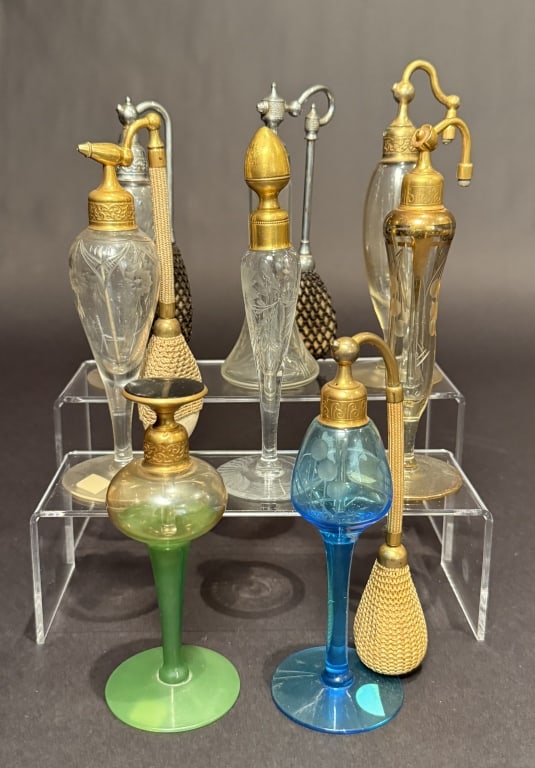 Collection Of 8 DeVilbiss Perfumes And Atomizers: Tallest 6.75". The Estate of the late Judy Boyd, New Jersey.STERLING ASSOCIATES STRIVES TO PROVIDE ACCURATE, OBJECTIVE, & FAIR INFORMATION ON ALL LOTS. WE WILL BE HAPPY TO ANSWER ANY QUESTIONS AND PRO