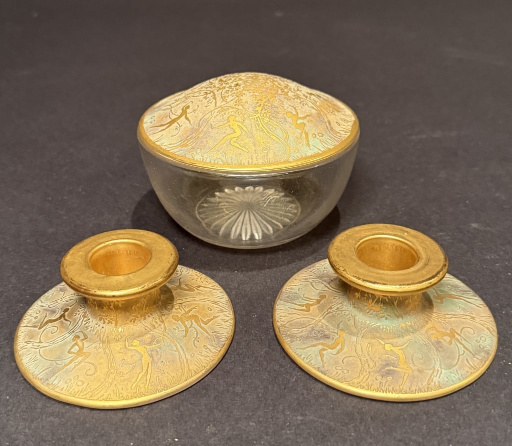 DeVilbiss Pair Of Candle Holders And Powder Box: Gilt Art Deco powder box 3.5" x 4.5". Candle sticks 1.5" x 3.75". The Estate of the late Judy Boyd, New Jersey.STERLING ASSOCIATES STRIVES TO PROVIDE ACCURATE, OBJECTIVE, & FAIR INFORMATION ON ALL LOT