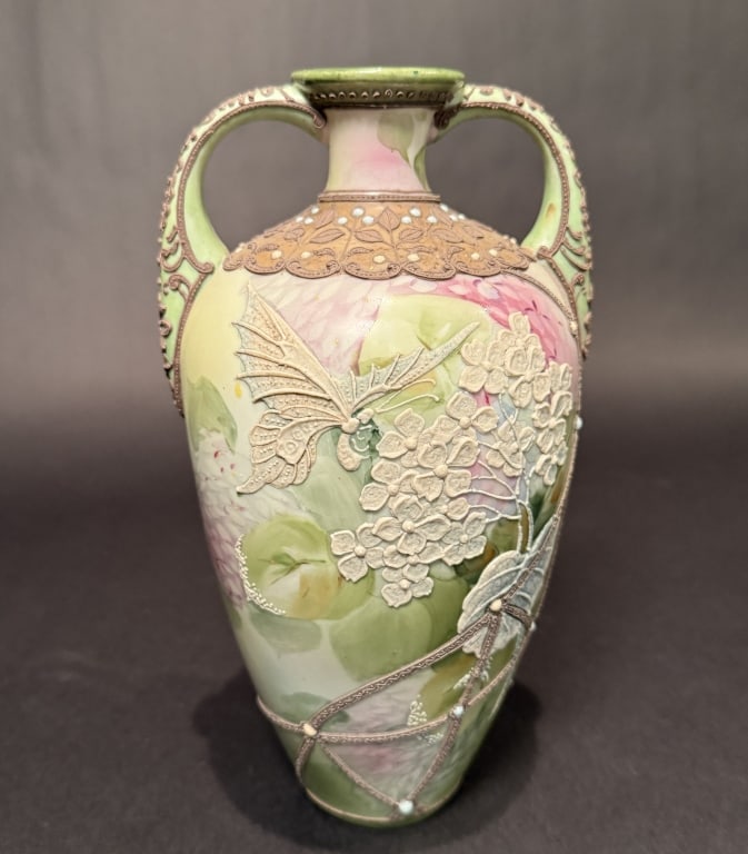 Nippon Moriage Butterfly Vase: Height 10.75". The Estate of the late Judy Boyd, New Jersey.STERLING ASSOCIATES STRIVES TO PROVIDE ACCURATE, OBJECTIVE, & FAIR INFORMATION ON ALL LOTS. WE WILL BE HAPPY TO ANSWER ANY QUESTIONS AND PRO