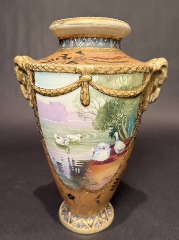Nippon Scenic Gilt Vase With Rams Heads: Height 10.75". The Estate of the late Judy Boyd, New Jersey.STERLING ASSOCIATES STRIVES TO PROVIDE ACCURATE, OBJECTIVE, & FAIR INFORMATION ON ALL LOTS. WE WILL BE HAPPY TO ANSWER ANY QUESTIONS AND PRO
