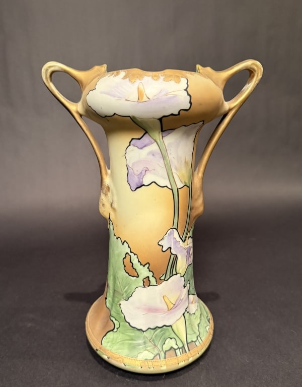 Nippon Hourglass Form Vase With Calla Lily: Art Nouveau Nippon Vase. Height 11.5". The Estate of the late Judy Boyd, New Jersey.STERLING ASSOCIATES STRIVES TO PROVIDE ACCURATE, OBJECTIVE, & FAIR INFORMATION ON ALL LOTS. WE WILL BE HAPPY TO ANSW