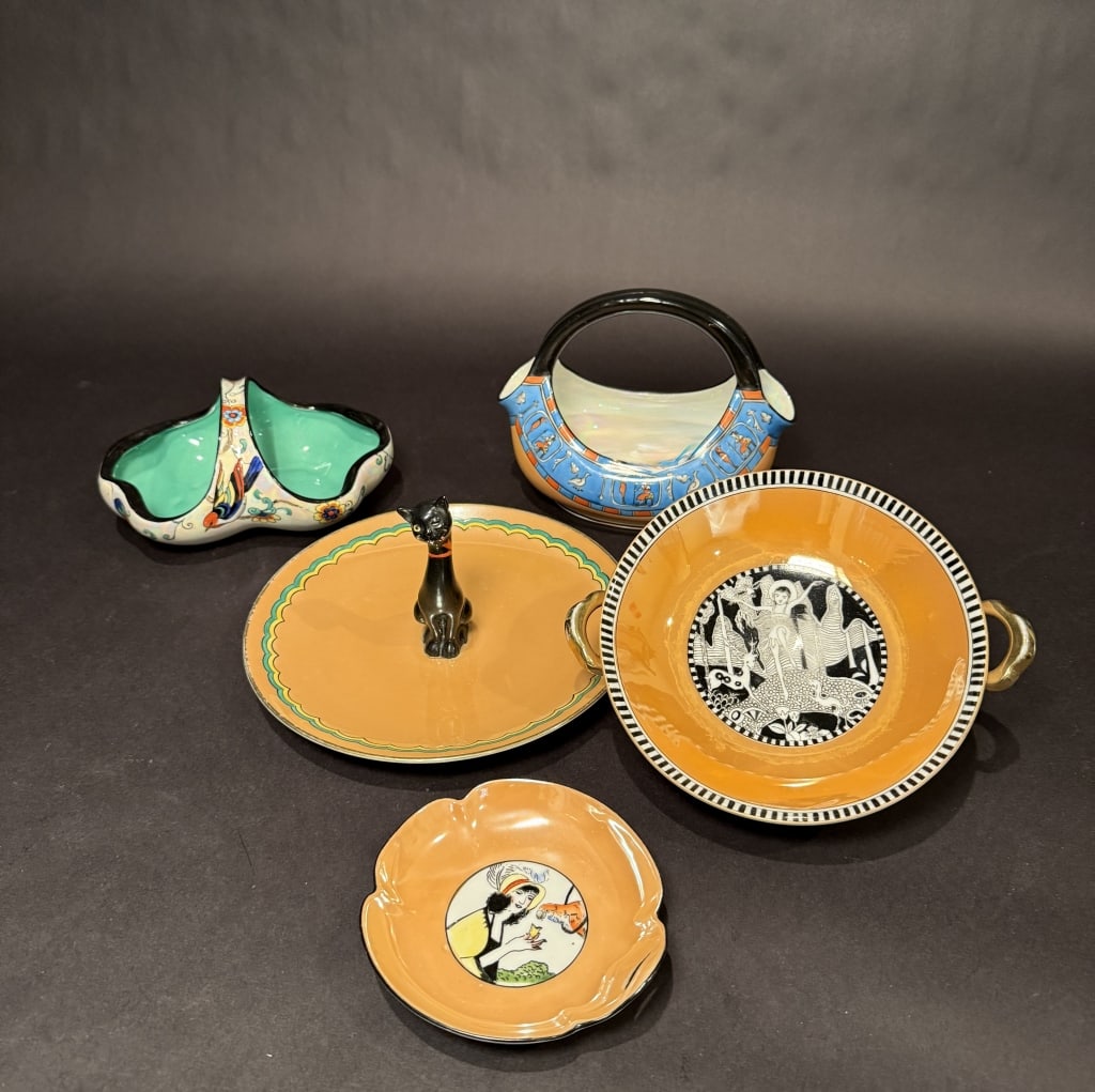 Collection Of 5 Noritake Art Deco Lusterware Items: Figural cat sandwich plate 4.25" x 8.75". 2 baskets. Trinket dish. Pedestal candy dish 7" x 8.25" x 2.25". The Estate of the late Judy Boyd, New Jersey.STERLING ASSOCIATES STRIVES TO PROVIDE ACCURATE,