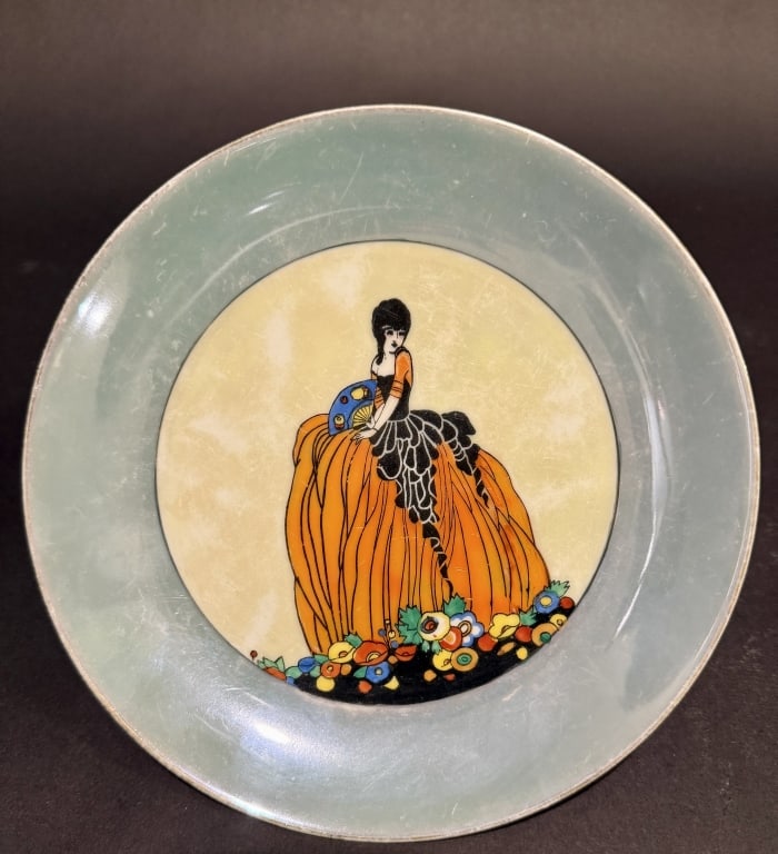 Noritake Art Deco Portrait Lustereware Plate: Art Deco lady in gown. Dia. 7.75 The Estate of the late Judy Boyd, New Jersey.STERLING ASSOCIATES STRIVES TO PROVIDE ACCURATE, OBJECTIVE, & FAIR INFORMATION ON ALL LOTS. WE WILL BE HAPPY TO ANSWER ANY
