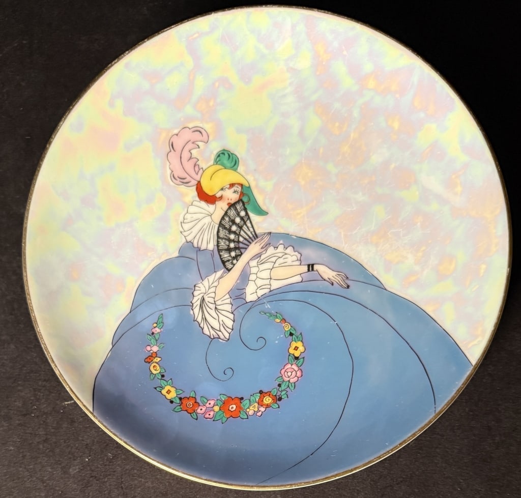Noritake Art Deco Portrait Lustreware Plate: Art Deco lady in gown. Dia 7.75"The Estate of the late Judy Boyd, New Jersey.STERLING ASSOCIATES STRIVES TO PROVIDE ACCURATE, OBJECTIVE, & FAIR INFORMATION ON ALL LOTS. WE WILL BE HAPPY TO ANSWER ANY