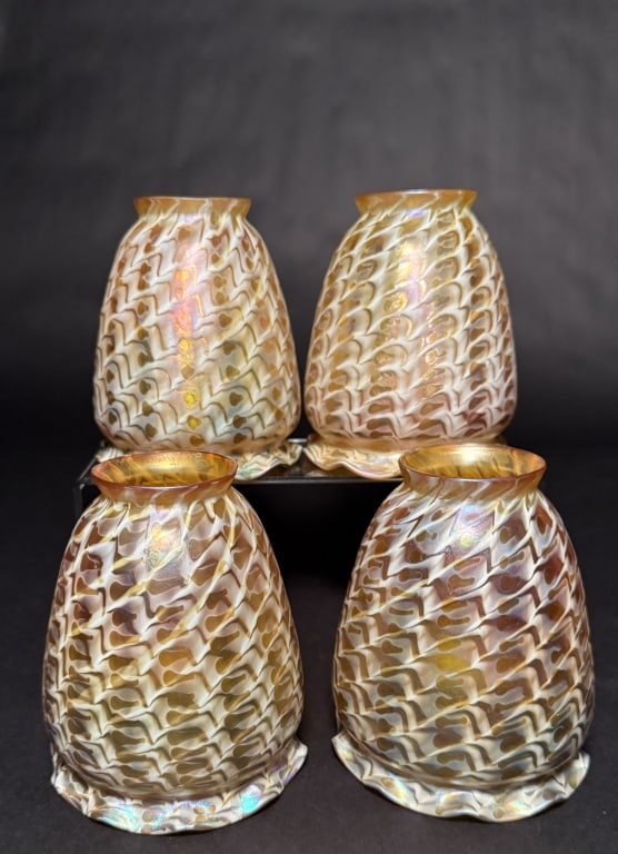 Set Of 4 Lustre Art Snakeskin Shades: Set of 4 Lustre Art snakeskin art glass shades. 5 1/4" H. 2" Fitter opening. The Estate of the late Judy Boyd, New Jersey.STERLING ASSOCIATES STRIVES TO PROVIDE ACCURATE, OBJECTIVE, & FAIR INFORMATION