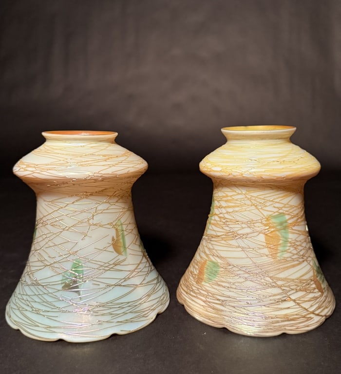 Quezal And Lustre Art Threaded Heart Shades: Quezal and Lustre Art threaded heart art glass shades. 2 similar threaded heart iridescent gold interior shades. 5 1/2" H. 5" Bottom opening. 2 1/8" Fitter opening. The Estate of the late Judy Boyd, N
