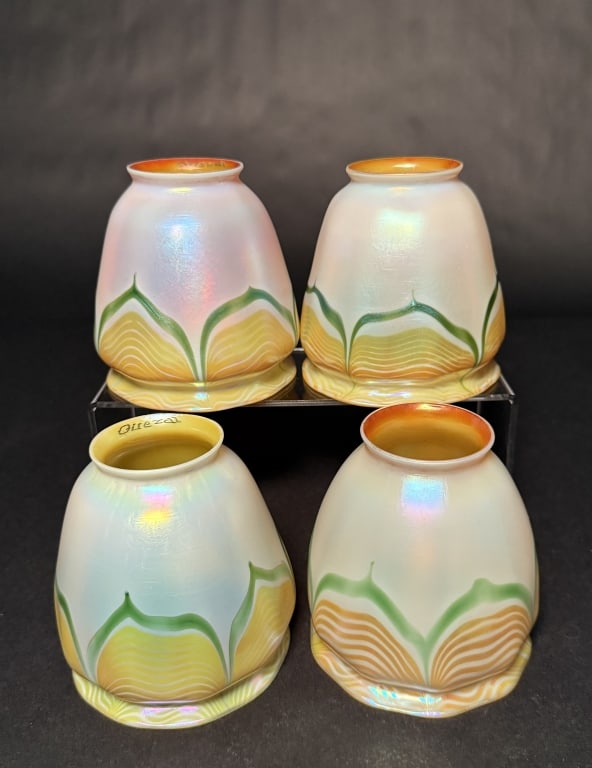 Set Of 4 Quezal Pulled Feather Shades: Four Quezal pulled feather iridescent art glass shades. 4 1/2" H. 4 1/8" Bottom opening. 2 1/8" Fitter opening. The Estate of the late Judy Boyd, New Jersey.STERLING ASSOCIATES STRIVES TO PROVIDE ACCU
