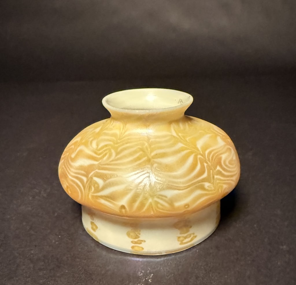 Quezal "King Tut" Shade: Gold and white "King Tut" pattern Quezal art glass shade. Old engraved Quezal mark. 3 1/2" H. The Estate of the late Judy Boyd, New Jersey.STERLING ASSOCIATES STRIVES TO PROVIDE ACCURATE, OBJECTIVE, &