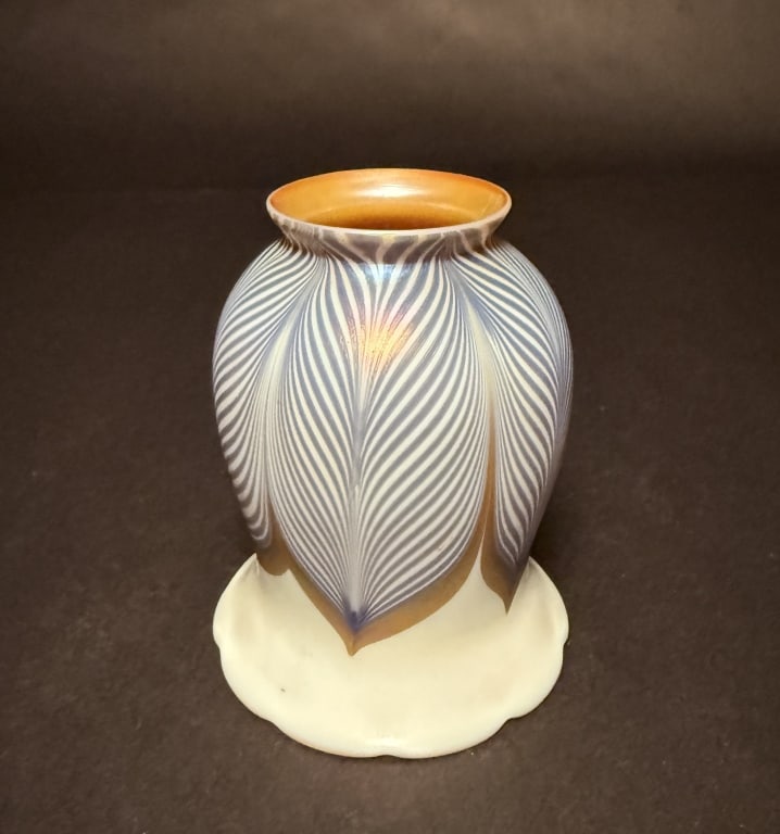 Lustre Art Blue And Gold Pulled Feather Shade: Lustre Art Pulled feather art glass shade in blue and glod. Glod aurene interior. 5 1/4" H. 4 1/8" Bottom opening.The Estate of the late Judy Boyd, New Jersey.STERLING ASSOCIATES STRIVES TO PROVIDE AC