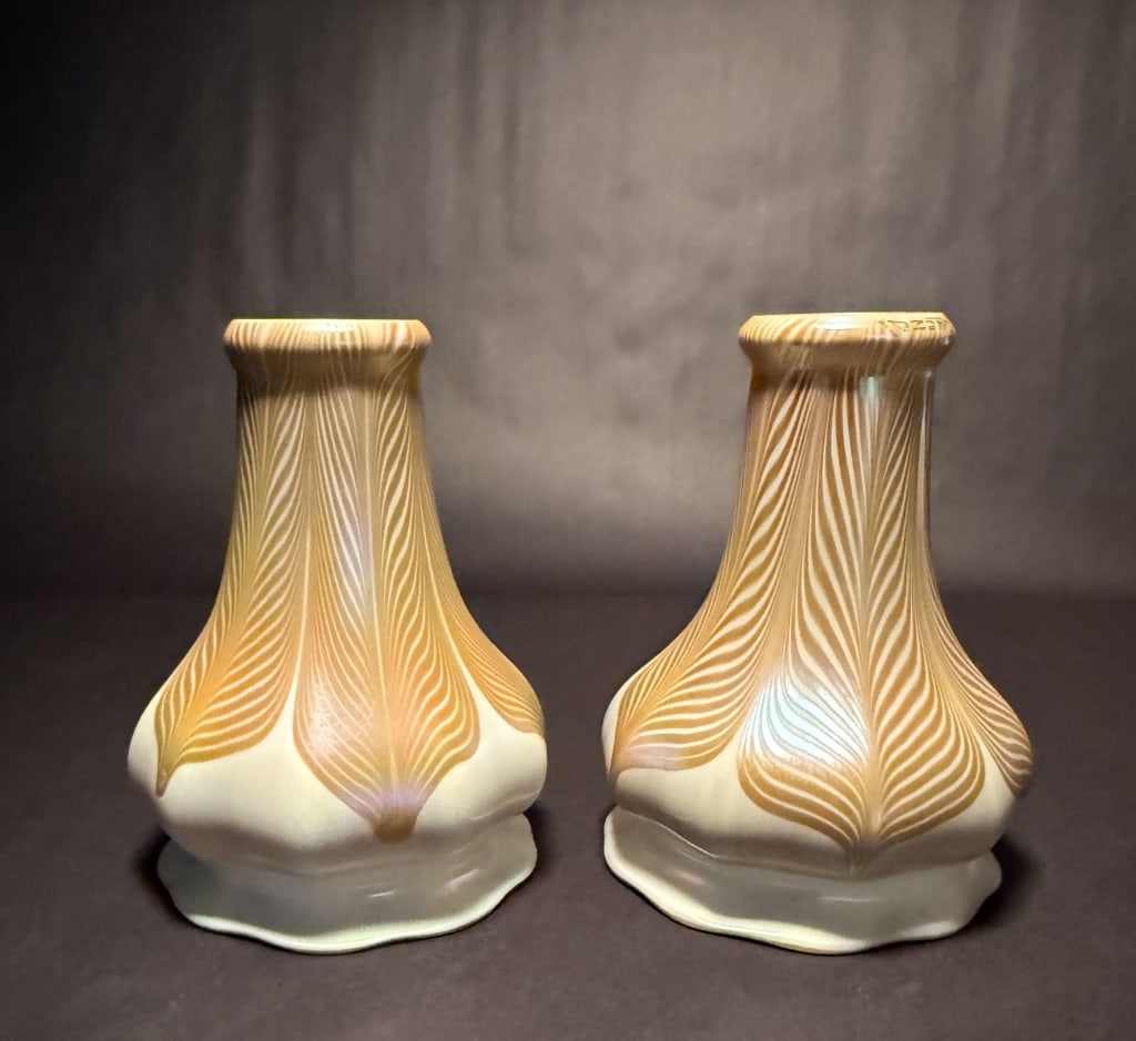 Pair Of Large Quezal Pulled Feather Shades: Pair of rare and unusual Quezal gold pulled feather art glass shades with gold iridescent interior.7 1/2" H. 2" Fitter interior opening. 5 1/2" Bottom opening. 2 5/8" fitter outside diameter. The Esta