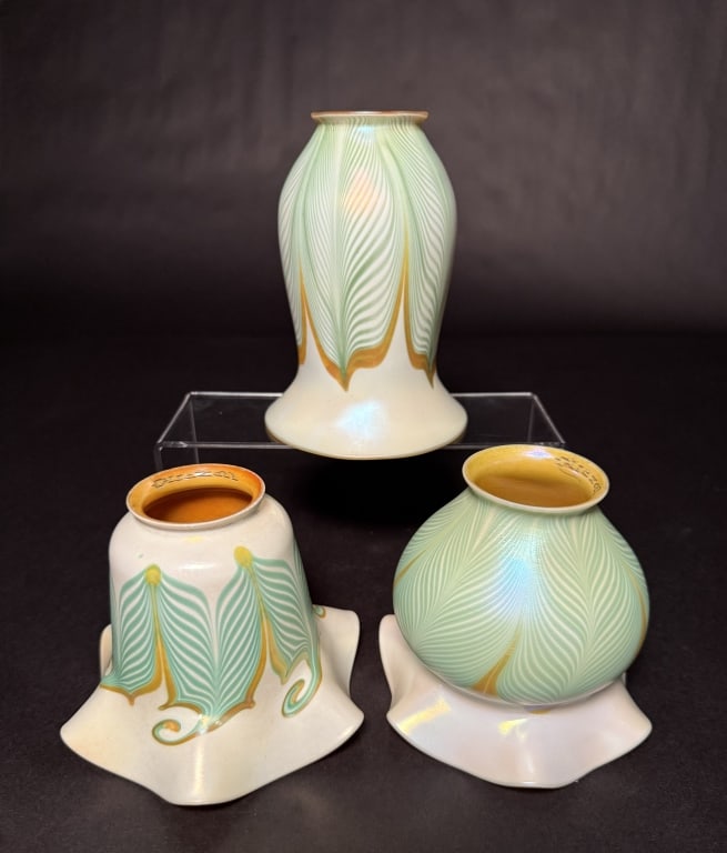 Collection Of 3 Quezal Pulled Feather Shades: Three Quezal green and gold pulled feather, one hooked, art glass shades with gold aurene interiors. 6 1/4" H of tallest. 2 1/4" Fitter openings. The Estate of the late Judy Boyd, New Jersey.STERLING 