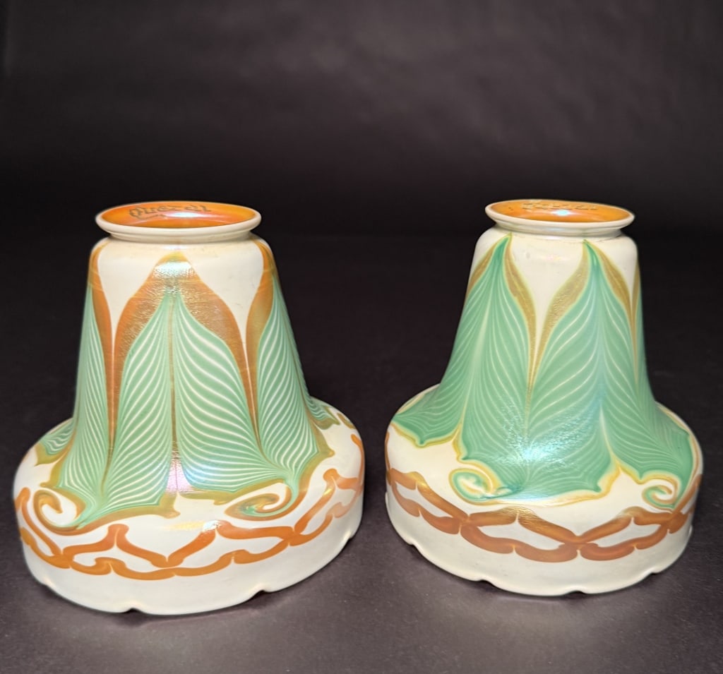 Pair Of Quezal Pulled Feather Bell Form Shades: Pair of unusual Quezal green and gold pulled feather art glass shades with gold decorated gallery and crimped bottom. 5 5/8" H. 2 1/4" Fitter. The Estate of the late Judy Boyd, New Jersey.STERLING ASS