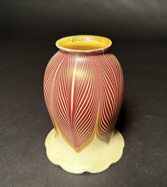 Quezal Selenium Red Pulled Feather Shade: Quezal pulled-feather selenium red tulip shade with crimped bottom and gold aurene interior. 5 1/4" H. 4 1/8" Bottom opening. 2 1/4" Fitter. The Estate of the late Judy Boyd, New Jersey.STERLING ASSOC